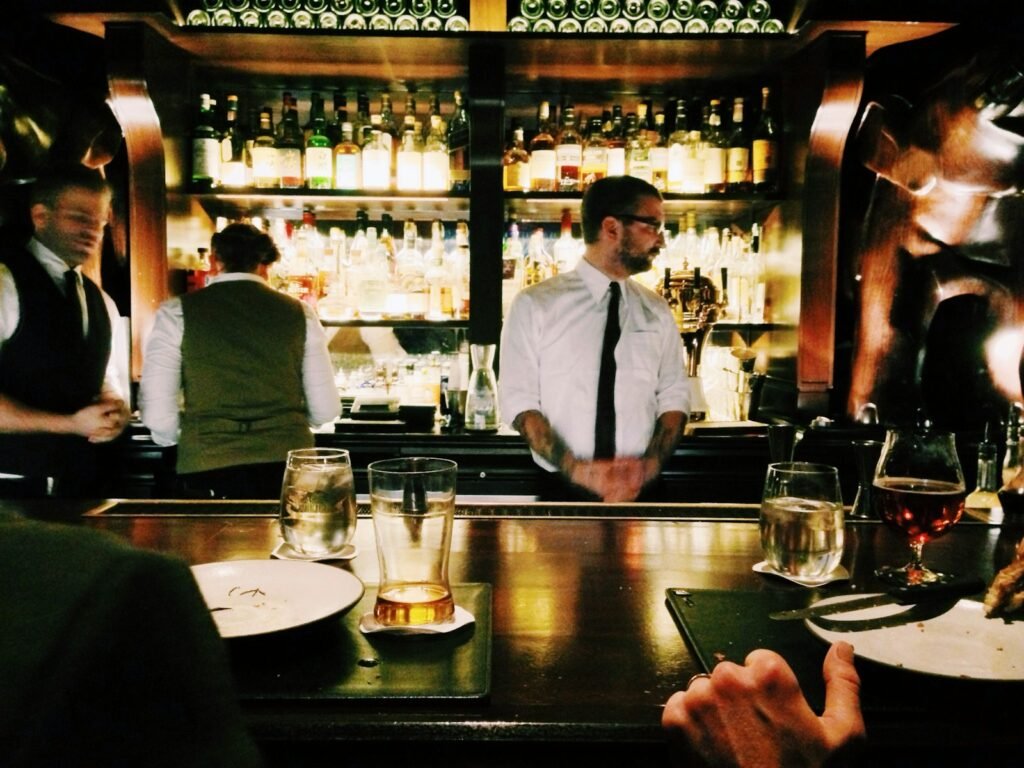 Bartender behind the bar
