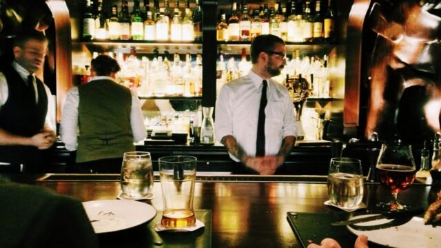 Bartender behind the bar
